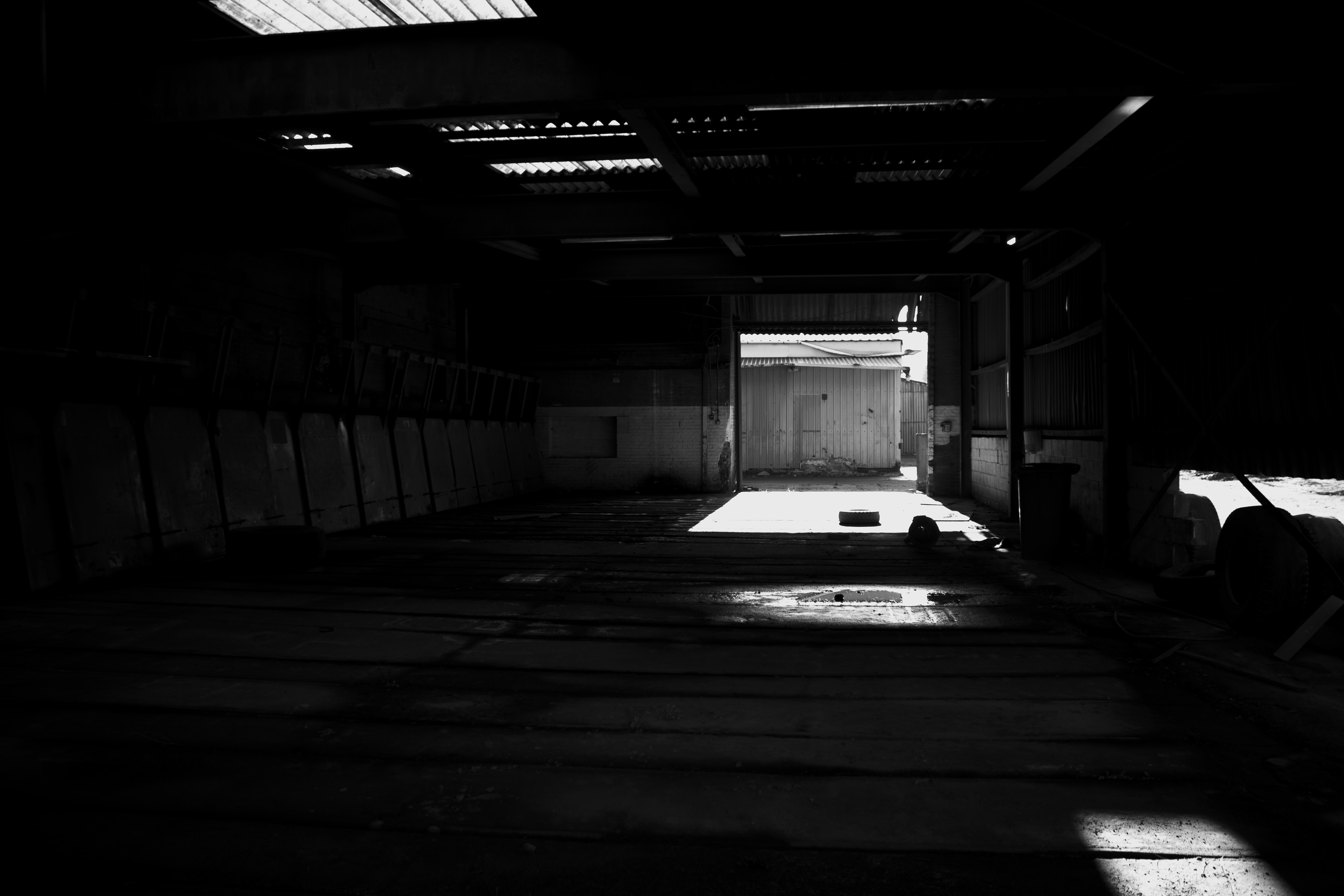 Shadowed interior with broken floorboards