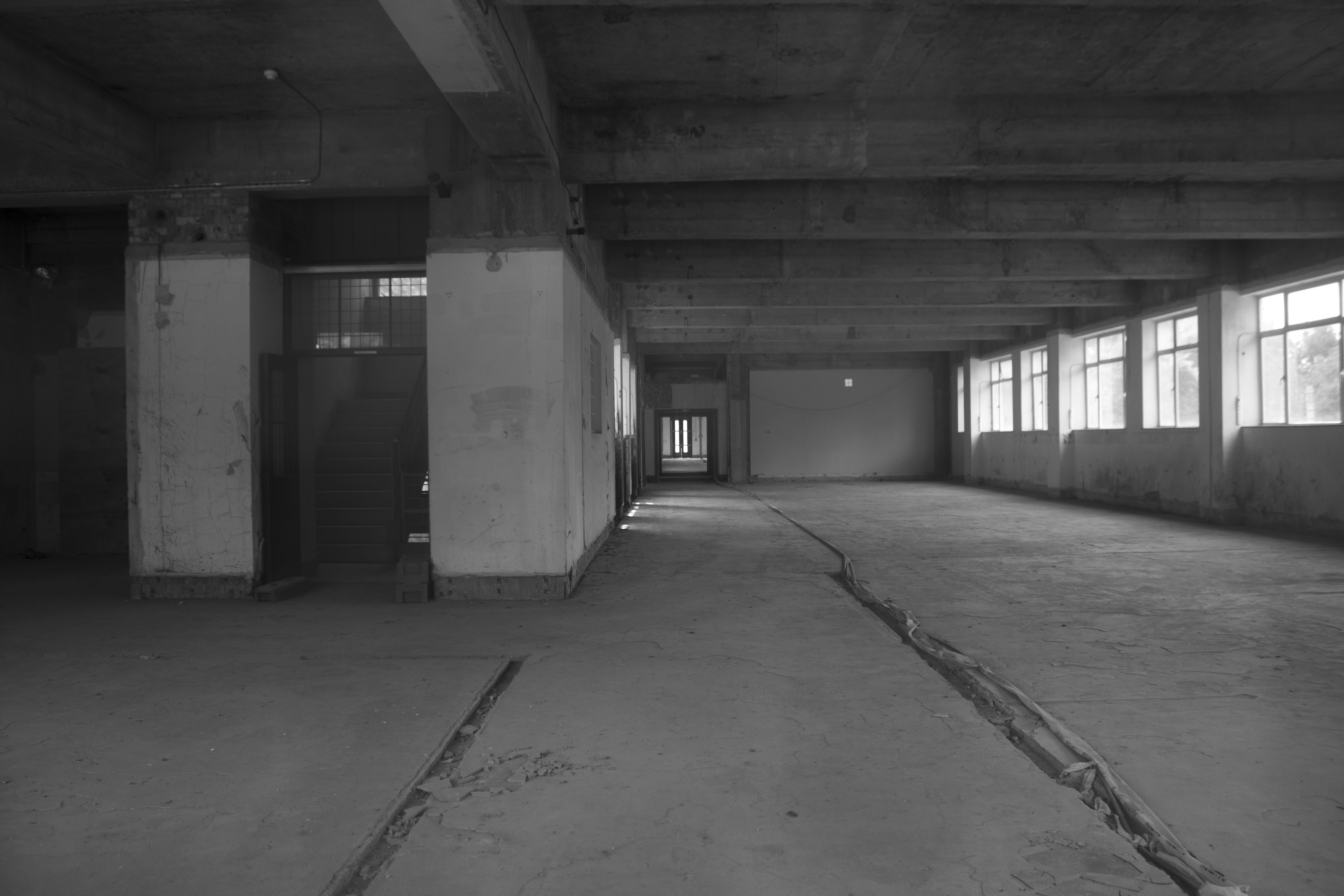 Empty office floor with broken windows