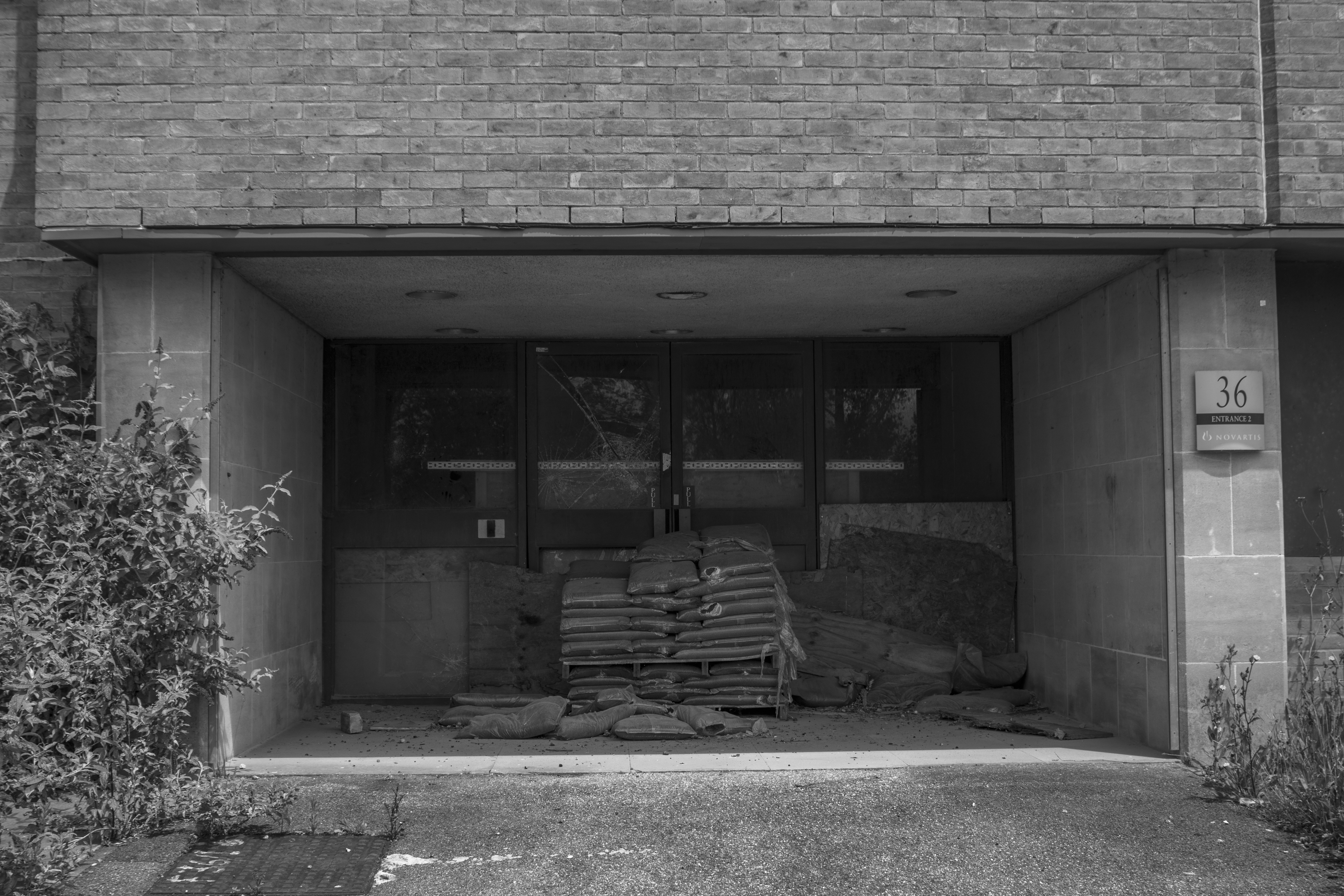 Abandoned corridor with debris-strewn floor