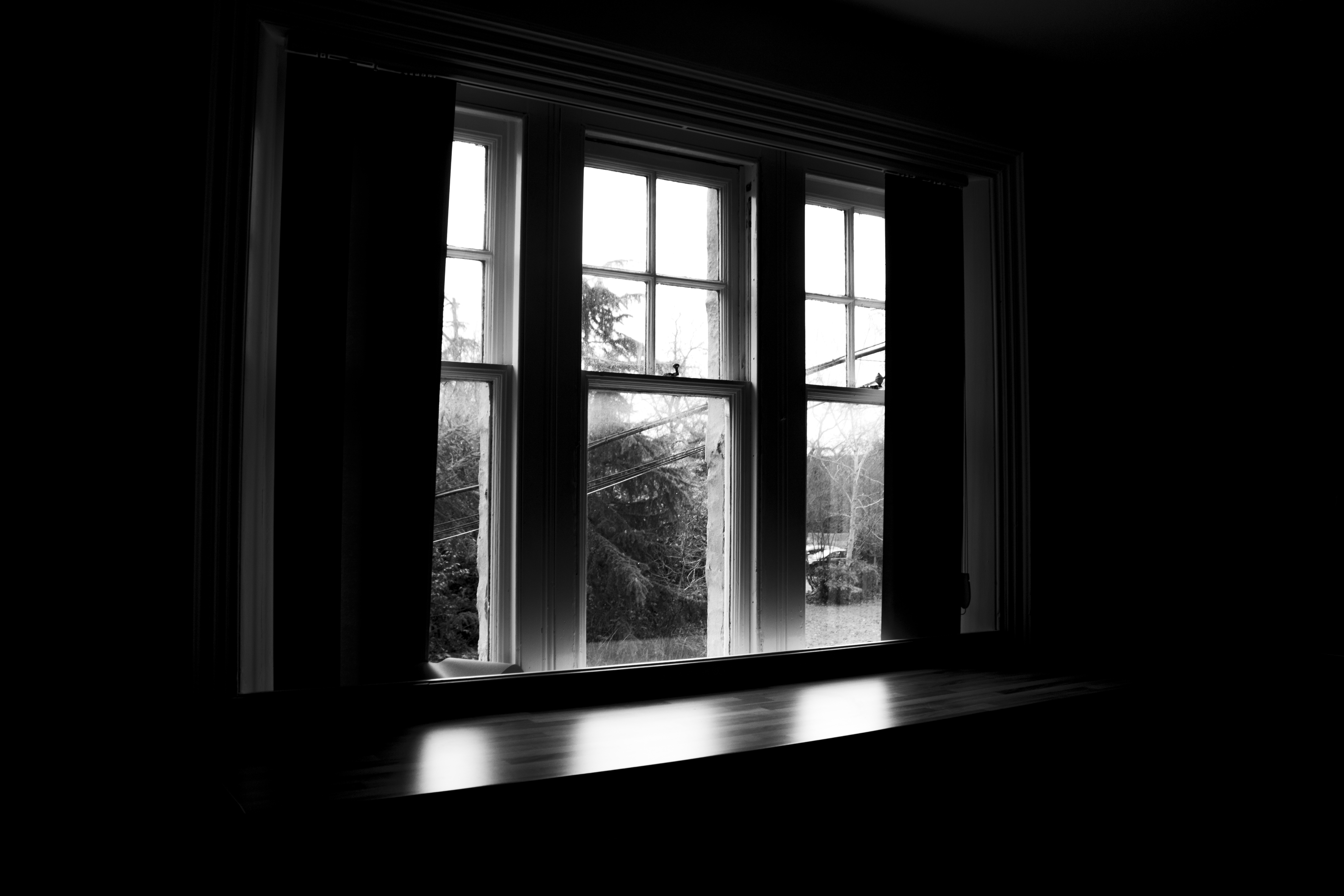 Window silhouette against dusk light